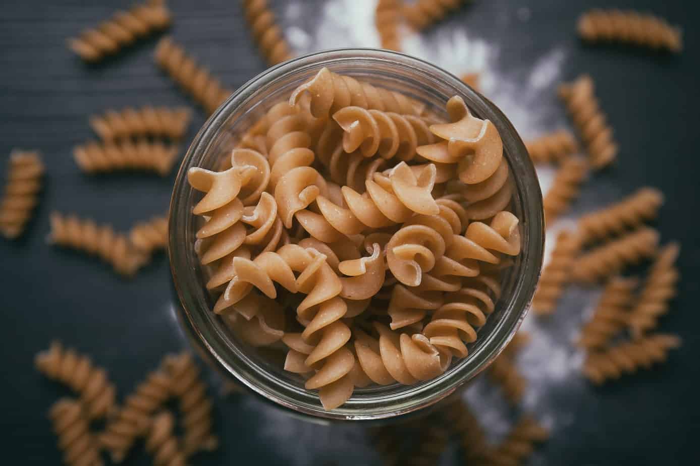 Overhead shot of uncooked whole wheat pasta. 